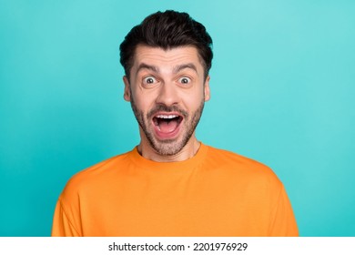 Closeup Photo Of Young Handsome Impressed Funny Face Guy Wear Orange T-shirt Open Mouth Excited Crazy Reaction Low Prices Isolated On Cyan Color Background