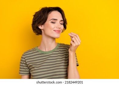 Closeup Photo Of Young Smiling Sniff Girl Showing Cool Aroma Like Buy Parfume Isolated On Yellow Color Background