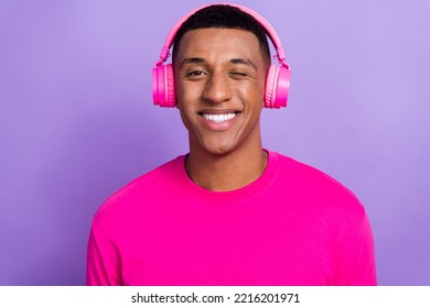 Closeup Photo Of Youngster Positive Macho Guy Student Blink His Eye Toothy Beaming Smile Hollywood Egocentric Isolated On Violet Color Background