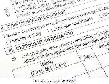 Close-up Photograph Of An Employee Group Health Insurance Application Form.