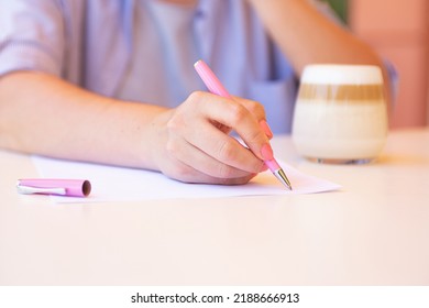 Closeup Photography Of Bussines Woman Sitting Outside And Sign Document.Coffee Cup With Mug Near.Business Defocused Background.