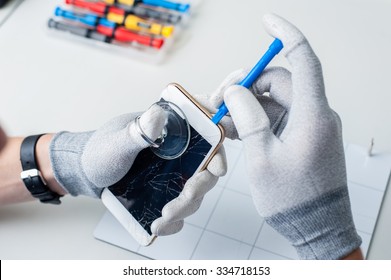 Close-up Photos Showing Process Of Mobile Phone Repair, Changing The Screen.