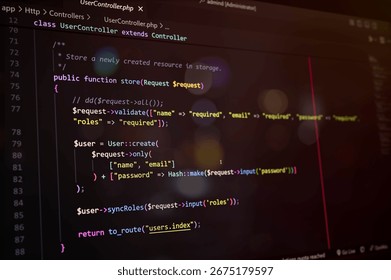 Close-up of PHP Laravel code on a dark editor screen, showcasing user update function and password hashing. Ideal for programming, coding, and web development concepts. - Powered by Shutterstock - Get 15% off with code: PIKWIZARD15