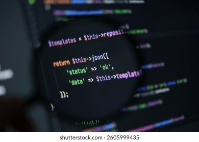 close-up of php source code showing json success response with status and data values under magnifying glass on dark screen background - Powered by Shutterstock - Get 15% off with code: PIKWIZARD15