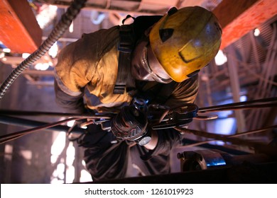 Closeup Pic Of Male Rope Access Abseiler Miner Maintenance Fitter Worker Commencing Abseiling Rope Body Transferring In Y Hang Positioning From Right To Left Construction Mine Site, Perth, Australia 