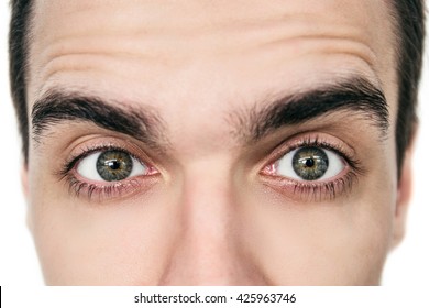 Close-up picture of green eyes from a young man