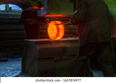 Close-up Picture Of Hot Steel Manual Forging Process With Big Mechanical Hammer Machine