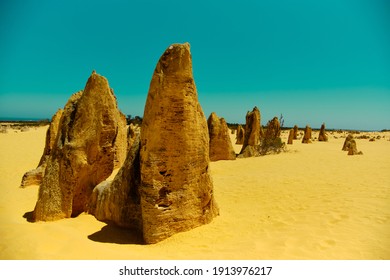 Close-up picture of a limestone rock at the Pinnacles desert with ocean at the background, no people, Pinnacles desert, Namburg national park, Western Australia WA, West coast near Perth