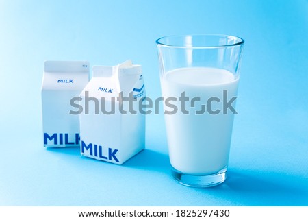 Close-up picture of milk in a glass and milk carton