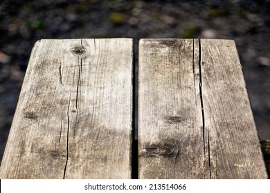 Close-up picture of an old wooden bench - Powered by Shutterstock