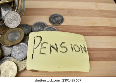 A closeup picture of Pension placed in front of coins spilled out of jar