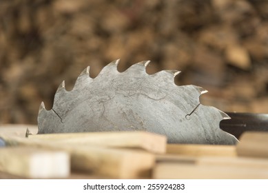 A close-up picture of a rusty circular saw in an old sawmill