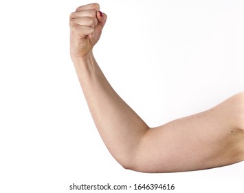 closeup picture of sporty woman flexing her biceps.