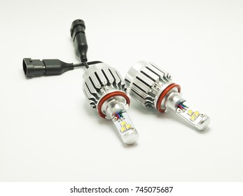 Closeup picture of two LED bulbs for car headlight on white background. Modern lighting technology. - Shutterstock ID 745075687
