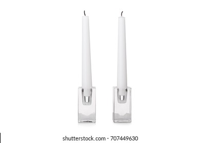 A Close-up Picture Of Two Long White Candles On Transparent Stands, Isolated On A White Background. Extinguished Candles For A Romantical Date Or Beautiful Dinner. Copy Space.