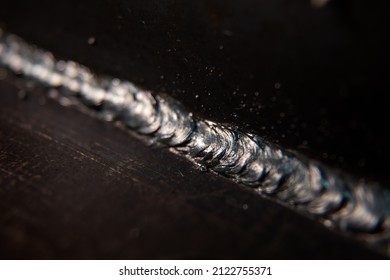 A Closeup Picture Of A Weld Connecting Two Steel Plates