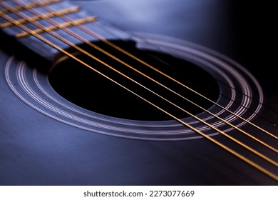 closeup picture of yellow guitar strings 
