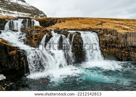 Close-up of the picturesque Kirkjufellsfoss waterfall near the famous Kirkjufell mountain on the north coast of the Snæfellsnes peninsula, near Grundarfjörður, Iceland