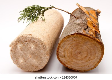 Closeup Of A Piece Of Firewood And A Wooden Briquette Against A White Background