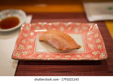 Closeup Of A Piece Of Yellowtail Nigiri.