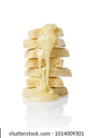 Close-up Pieces Of Porous White Chocolate Bar Poured liquid Chocolate Isolated On White Background