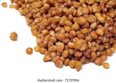 Closeup Of A Pile Of Cooked Lentils Isolated On A White Background