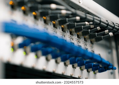 close-up of a pile of network patch cables in a server room in a data center room Data transmission fiber optic information technology - Powered by Shutterstock - Get 15% off with code: PIKWIZARD15