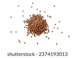 Closeup of a pile of organic uncooked lentils isolated on a white background from above, top view