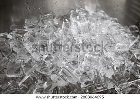 Closeup of a pile of sharp broken glass shards on a dark surface
