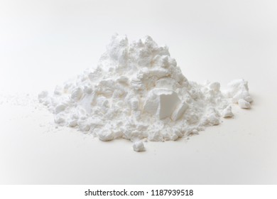 Close-up of pile of tapioca starch or flour powder on white background