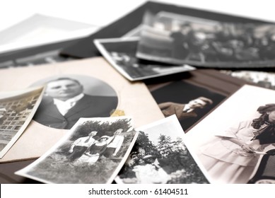 Closeup of a pile of vintage family photos - Shutterstock ID 61404511