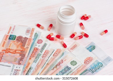 Closeup Of Pills And Money. Health Care Concept