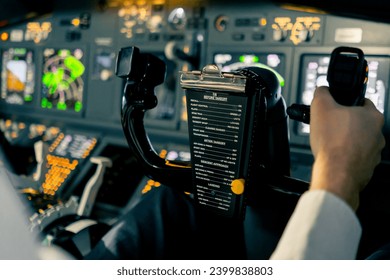 close-up Pilot in the cockpit of an airplane holding a rotary steering wheel during flight Air travel concept
