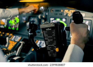 close-up Pilot in the cockpit of an airplane holding a rotary steering wheel during flight Air travel concept