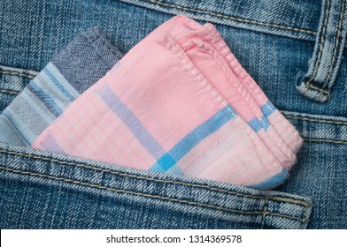 Closeup Of Pink Fabric Hanky In Blue Jeans Pocket 