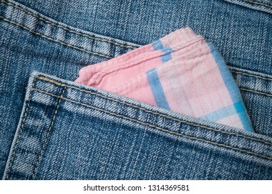 Closeup Of Pink Fabric Hanky In Blue Jeans Pocket 