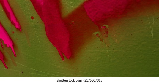 Closeup Of Pink Graffiti On A Green Metal Wall.