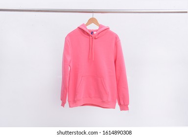 Closeup Pink Hoodie Sweatshirt On Hanger 
