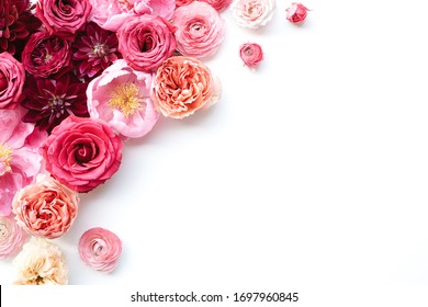 Closeup of pink peony, ranunculus, rose corner frame design with white background and empty space for text or marketing copy, rosebuds, peonies, garden roses, blush floral design - Shutterstock ID 1697960845