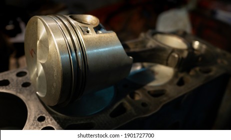 Close-up Of Piston And Rings On The Connecting Rod. Details Of The Car. Internal Combustion Engine. Car Parts And Piston Group. Car Engine And Motor Repair