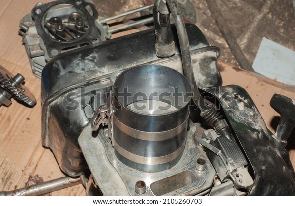 Close-up of piston and rings\
on the connecting rod. Details of the car. Internal combustion\
engine.