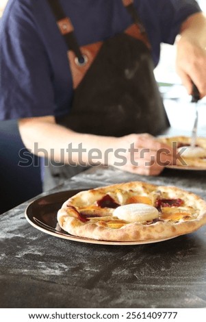 Similar – Image, Stock Photo Anonymous chef preparing pizza in a pizzeria