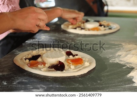 Similar – Image, Stock Photo Anonymous chef preparing pizza in a pizzeria