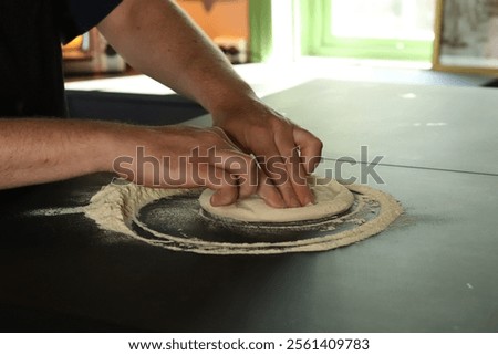 Similar – Image, Stock Photo Anonymous chef preparing pizza in a pizzeria