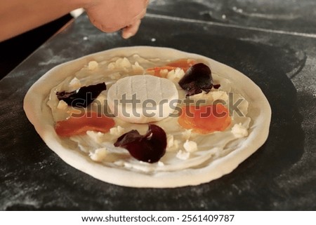 Similar – Image, Stock Photo Anonymous chef preparing pizza in a pizzeria