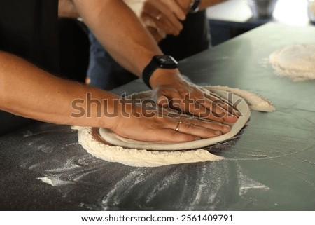 Similar – Image, Stock Photo Anonymous chef preparing pizza in a pizzeria