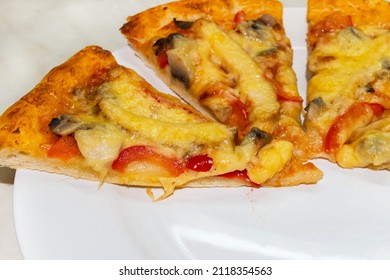 Closeup pizza sliced on white background, with bell peppers, meat, mushrooms, and parmesan. Delicious pastry crust. - Shutterstock ID 2118354563