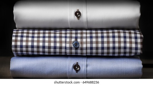 Close-up of Plaid Folded Men's Shirts - Powered by Shutterstock