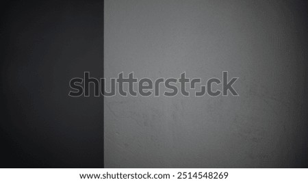 Close-up of a plain dark gray wall with a smooth, slightly textured surface. The minimalist and neutral background is perfect for use in design, presentations, or as a backdrop for creative projects