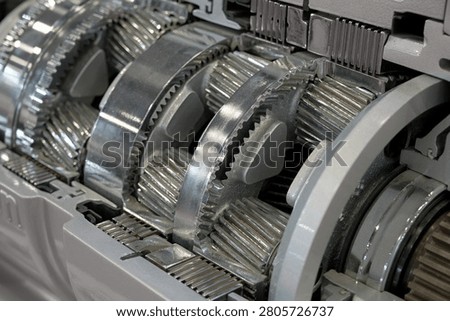 Close-up of a  planetary gear set automatic transmission in section, showing the precision teeth and metallic texture during a gearbox. Can be used as teaching materials and visual aids.